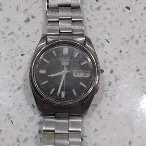 Seiko Black and Silver Watch with Day-Date Feature
